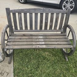 Rustic wooden wagon wheel bench