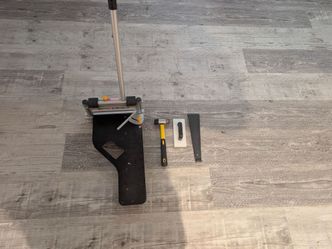 Heavy-duty LVP cutter, double-faced mallet, heavy steel pull bar, and tapping block.