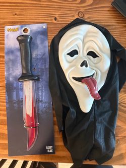 Funny scary movie mask with toy knife