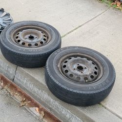 2 -14's Honda Civic Rims & Tires 4x100 Tires Hold Air About 40% Threads Asking $50 Both Firm on Price 