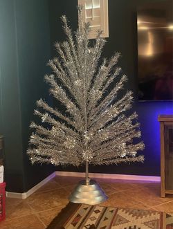 6.5’ aluminum Christmas tree. Pom Pom with original stand (not pictured)