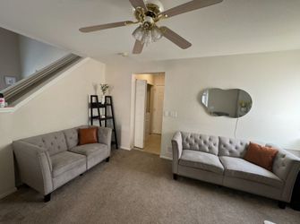 Two sofas for a small space: one for three people and the other for two.