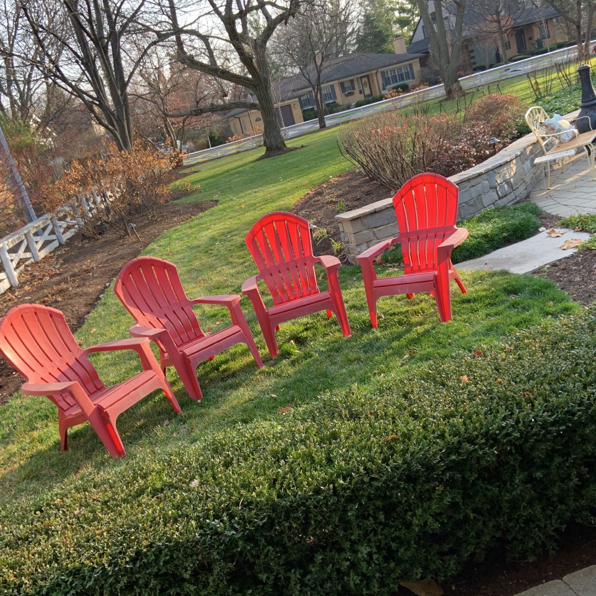 4 red plastic chairs