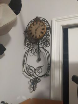 Beautiful stone face Bombay wrought iron clock
