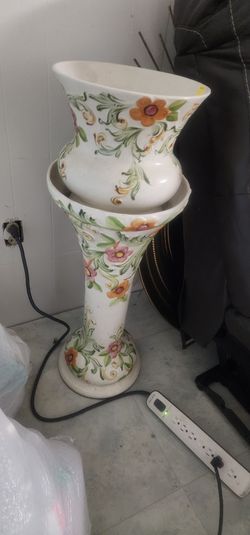 Porcelain garden pot and stand.