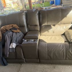 Recliner two seat sofa with console