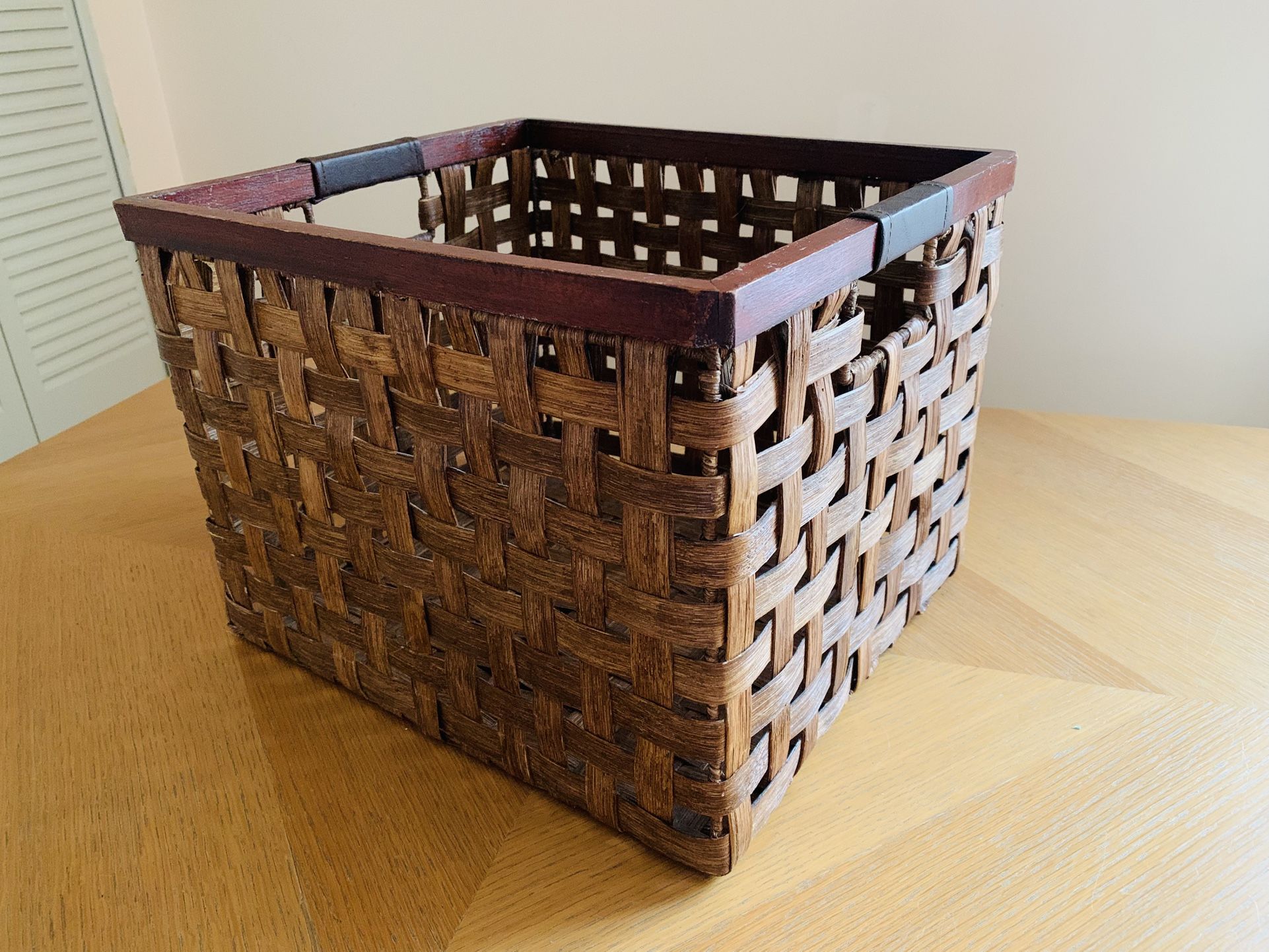 Woven basket with leather handle, basket, bin