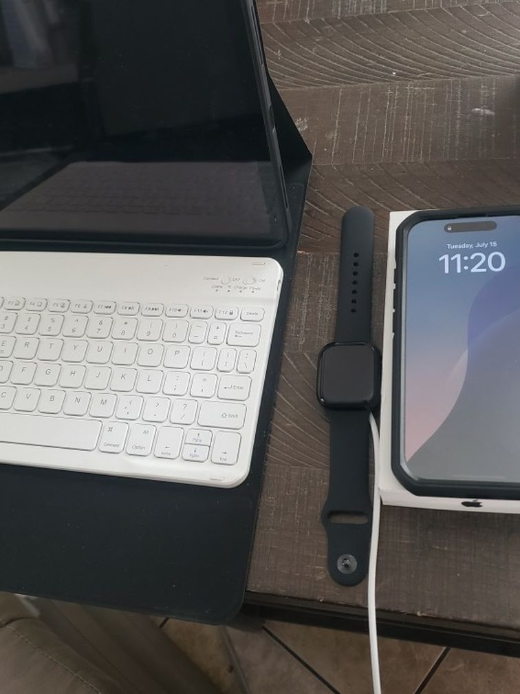 10 inch ipad with keyboard apple watch and IPhone 16 pro