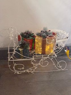 2 large outdoor Christmas reindeers with 1 sled & 3 Christmas boxes.