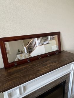 Entryway Mirror with hooks in great condition.