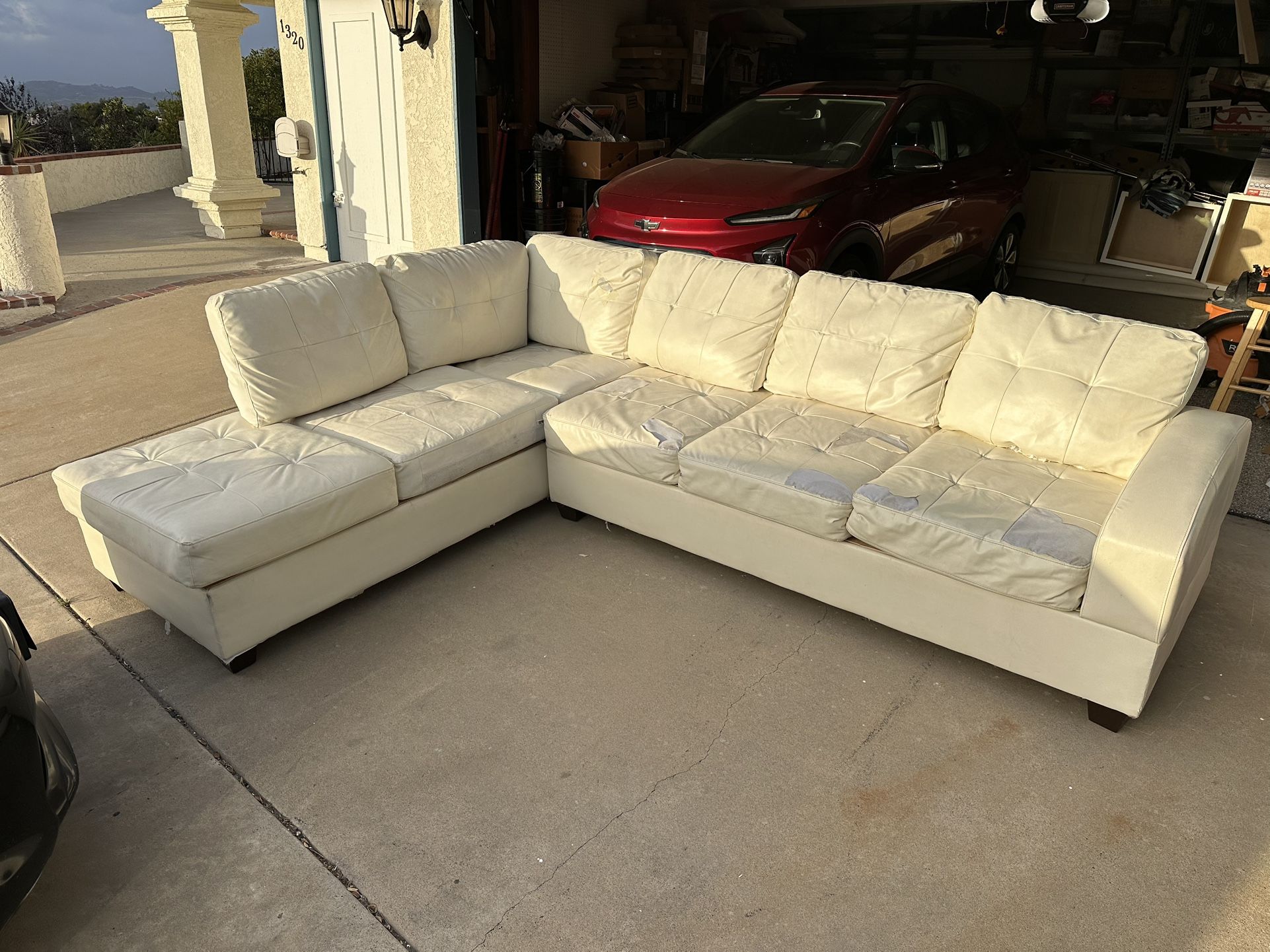 Free β sectional leather sofa (some tears, see photos)