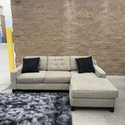 Light beige sectional sofa with reversible chaise 