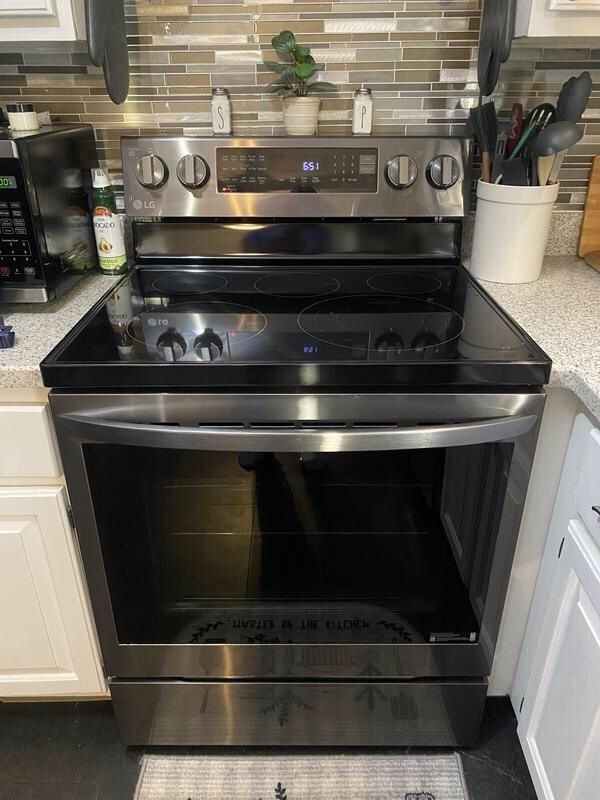 Black stainless steel stove with air fryer oven