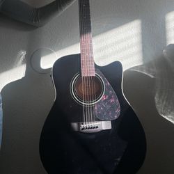 Black Yamaha 6 string acoustic/electric guitar 