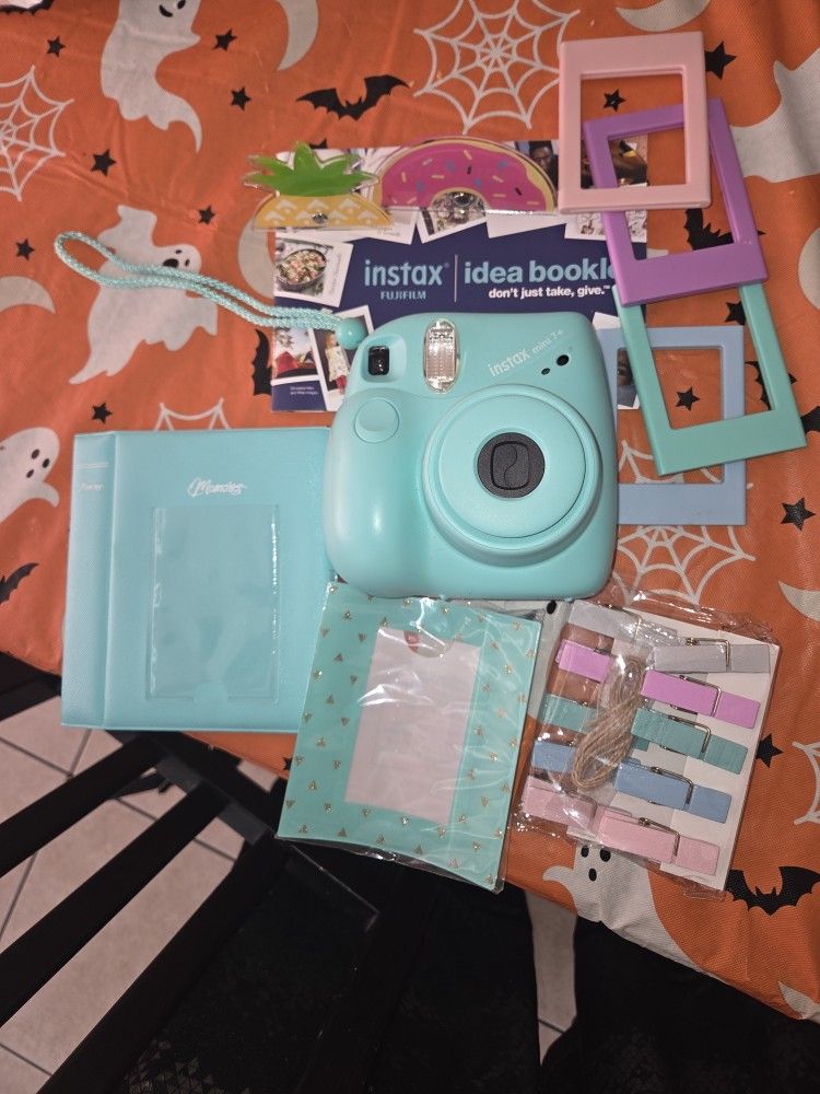 INSTAX MINI 7+ WITH MINI ALBUM AND LOTS OF FRAMES