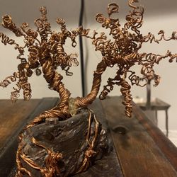 Copper wire tree on a meteorite