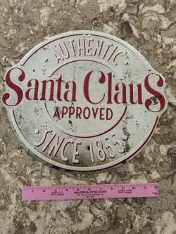 Vintage-style sign with 'Authentic Santa Claus Approved Since 1855' text. Made to look weathered.