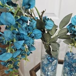 Two Cylinder Vases With Crystal Pebbles and Flowers