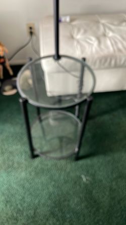 Glass end table with a lamp