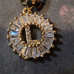 letter L inside a round CZ frame