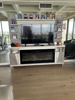 Entertainment center with electric fireplace with remote