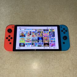 NINTENDO SWITCH OLED with 125 SWITCH GAMES INSTALLED