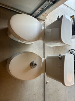 2 used residential toilets