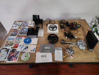 Wii console with accessories and games