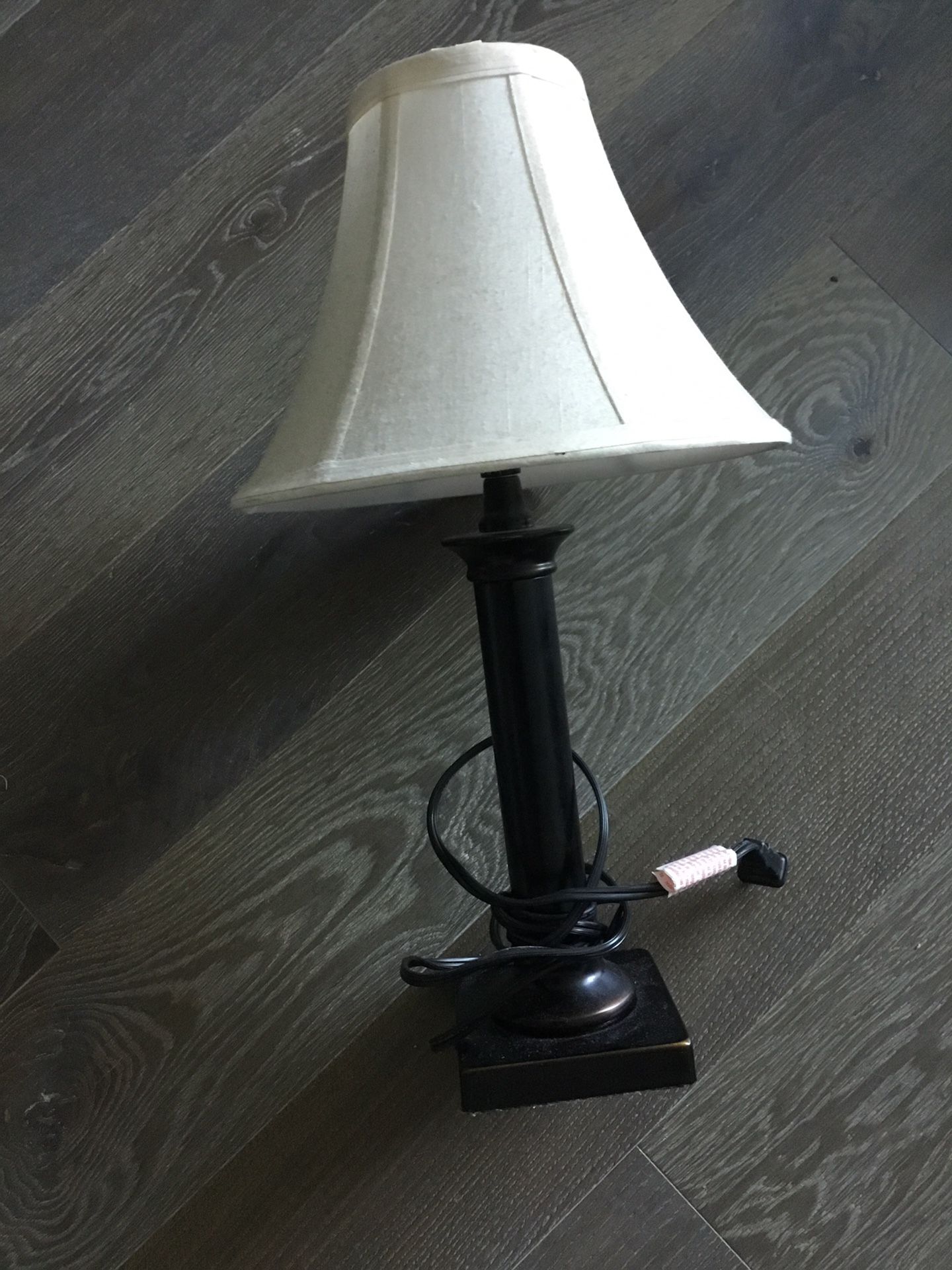 Black metal lamp with off white shade