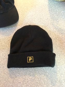 Men’s Primitive beanie and women’s adidas hat