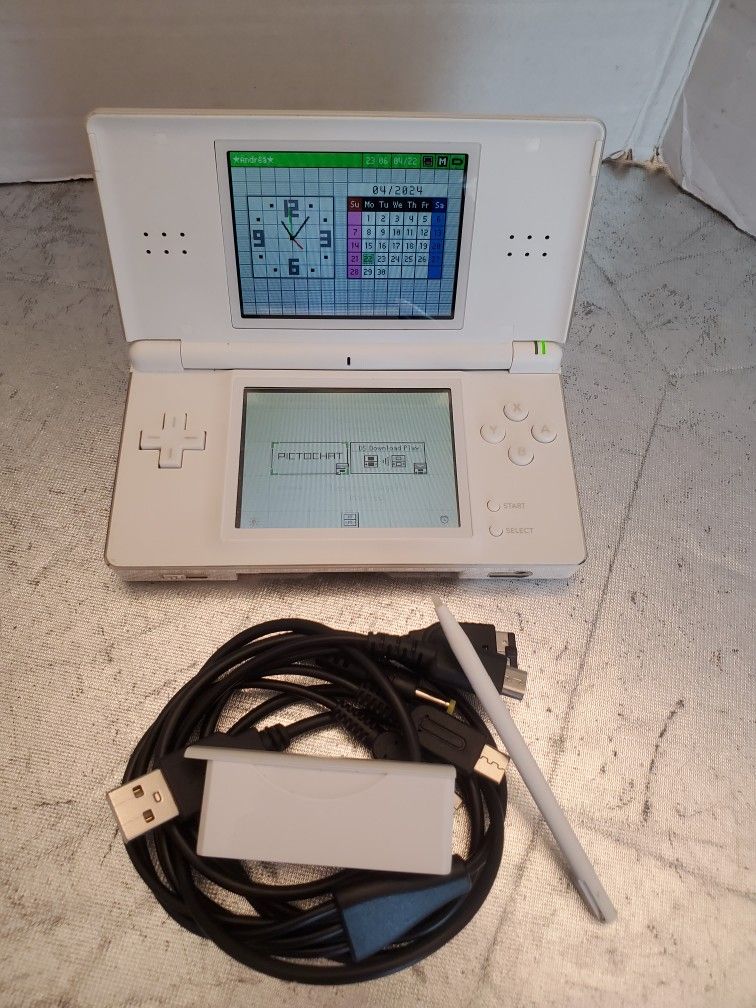 Nintendo DS Lite, plays both Game boy Advance and DS games with universal UBS charger. 
