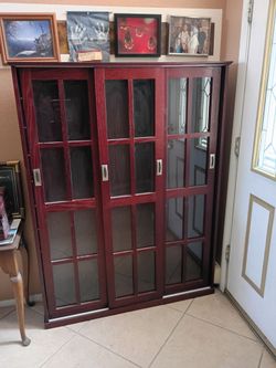 $200.00. Entertainment Center/ Media Center/ Shelving Unit.  Made of red oak.  25 shelves.