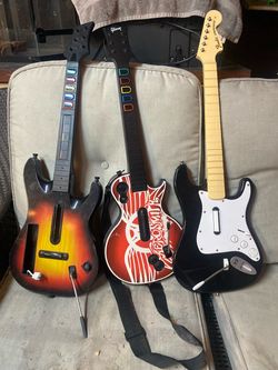 Rock band and guitar hero guitars for PlayStation and Wii