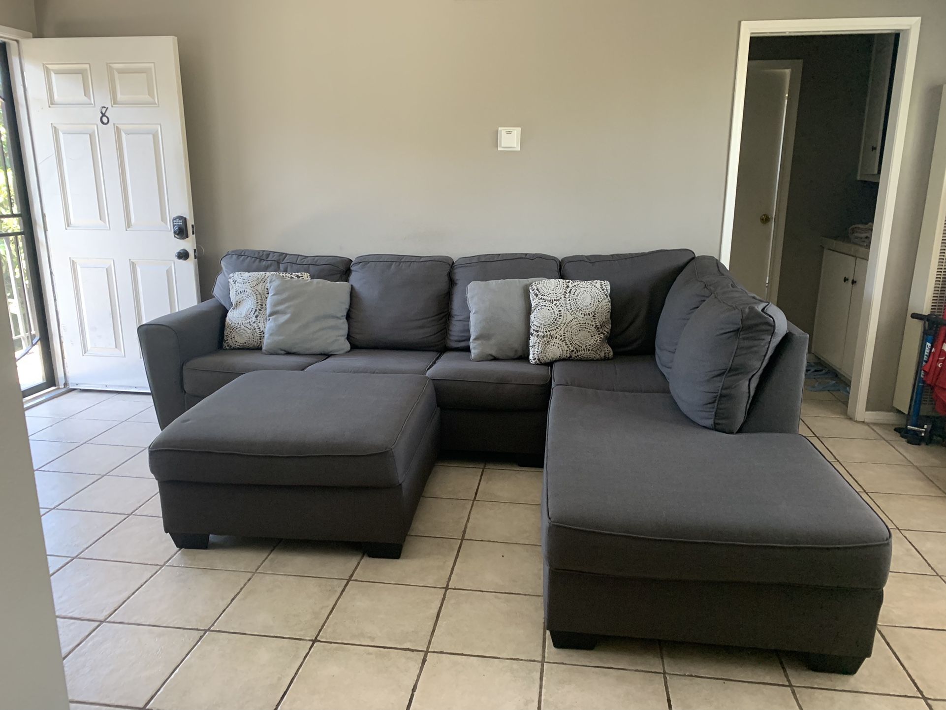 Living Spaces Sectional Couch With Ottoman