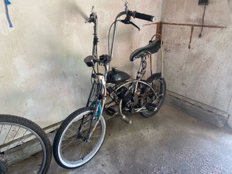 Two motorized vintage bicycles