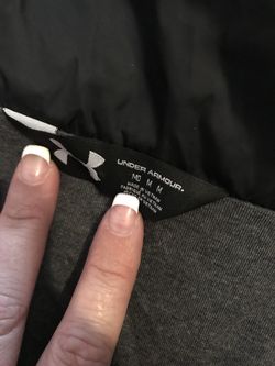 Woman’s medium under armour black vest with hood