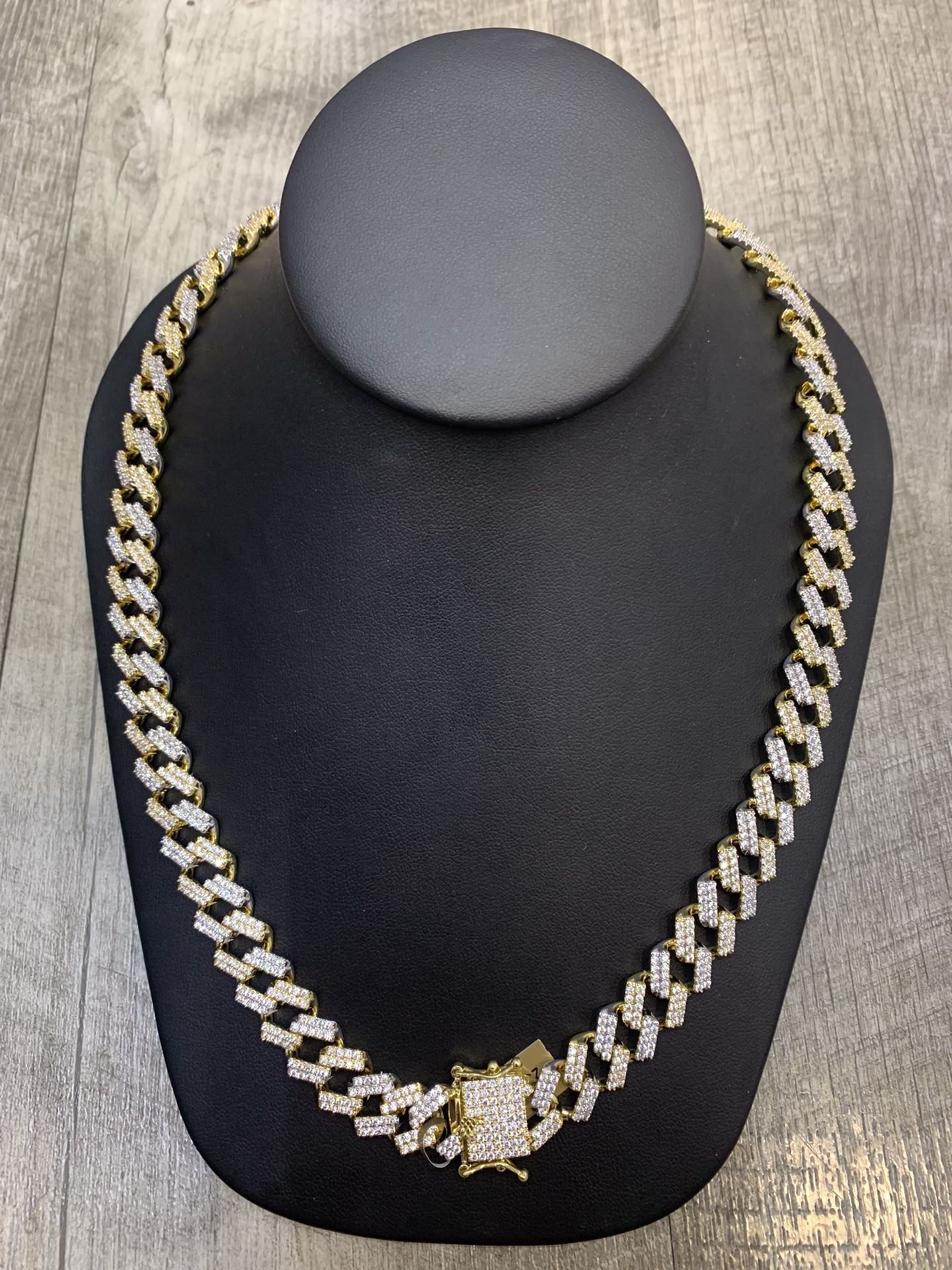  18 karat Gold plated Hip Hop 12.5 mm Cuban link 20” brass prong set Cubic Zircon simulated stone with solid weight being two toned with a secu