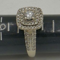 10kt white gold engagement ring 5 grams ,size 8, with main round diamond 0.30pts; 60 small round diamonds 0.70pts . 1 carat total approximately. 86241
