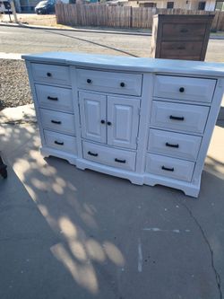 Real solid wood freshly sanded and painted 10 drawer dresser plus storage area behind the two doors in the middle