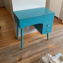 Blue antique sewing table