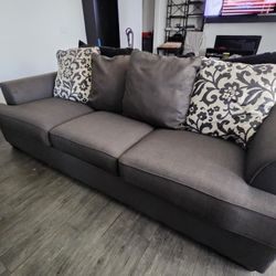 Grey Modern, Three Seater Couch. Damask Style Pillows $90 OBO
