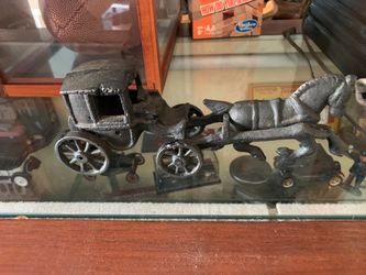 Antique cast iron horse and buggy