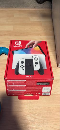 Nintendo switch oled with box, docking station, two steering wheels, Joycon grip, Mario game and charger. No trades cash only. Check my other listings