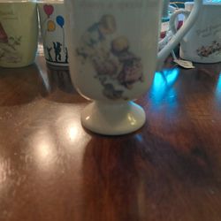 A Cup With A Bpy And A Girl