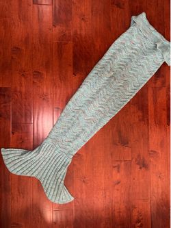 Knitted light blue mermaid tail blanket