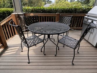 classic black powder-coated steel (wrought-iron style) outdoor patio dining set