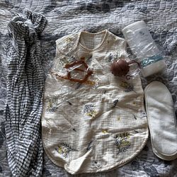New and used baby stuff sling,diaper liners,silicone teether, pacifier holder,cotton sleeper