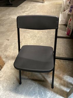 7 black folding chairs Cosco