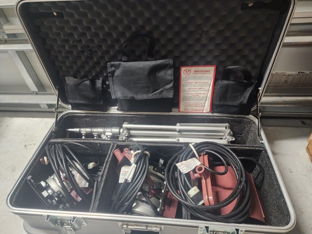 Photographer Lighting With Hard Case.