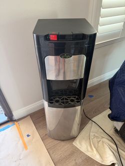 Viva bottom-load water cooler with self-clean feature, black and stainless steel finish, dual dispenser spigots, and drip tray. Bottom-load style with